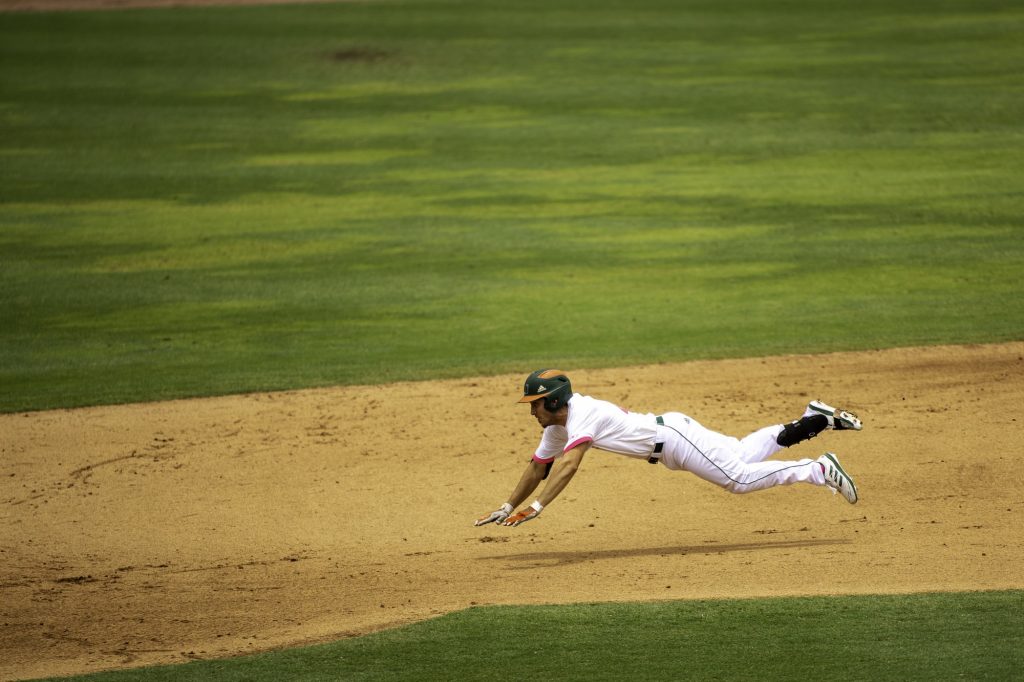 Redshirt junior Christian Del Castillo makes a long diving slide into second base in Miami's win over Appalachian State on Sunday May 9 at Mark Light Field. Del Castillo tallied three hits in three at bats for the Canes' in their 10-2 victory.
