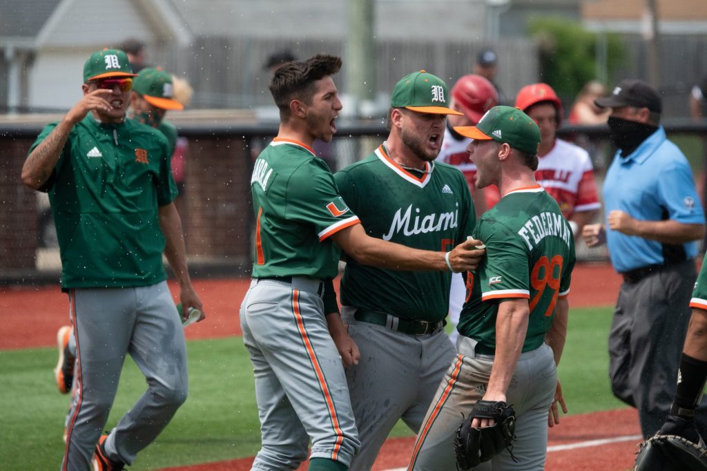 The Hurricanes celebrate a victory over the Louisville Cardinals on May 22 in Louisville, Kentucky.