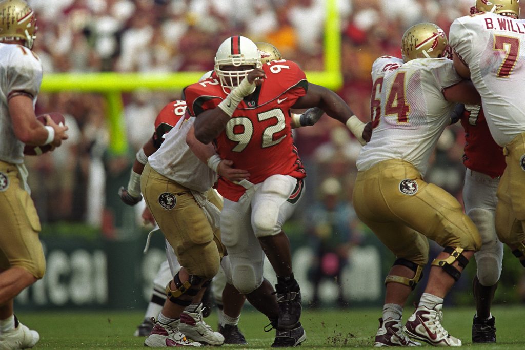 Damione Lewis (92) breaks through the line and runs towards FSU quarterback Chris Weinke in the legendary Wide Right II, where No. 7 Miami won 27-24 over No. 1 Florida State.