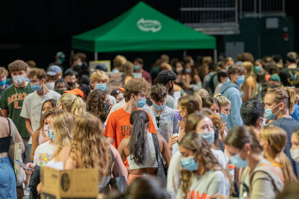Students walk through rows of booths showcasing a portion of the 300+ student organizations and departments at Canefest 2021 in the Watsco Center, on Aug. 22, 2021.