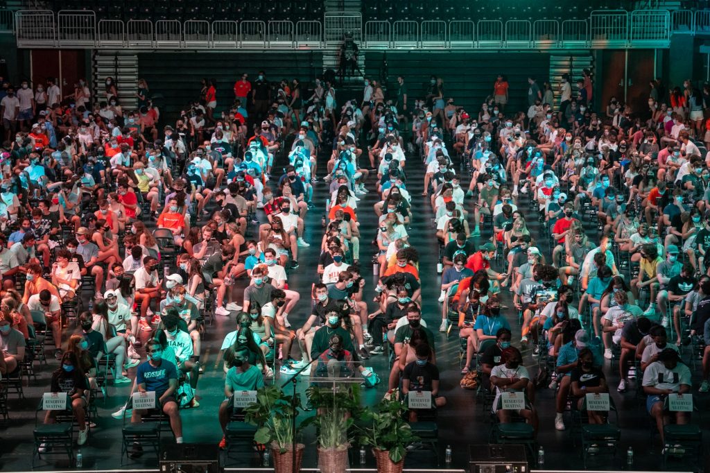 Freshmen of the Class of 2025 await the start of the President’s Welcome and Canes Take Flight programs in the Watsco Center on Aug. 19, 2021.