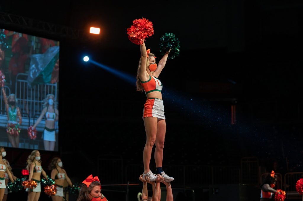 A UM cheerleading flyer welcomes the Class of 2025 during the Canes Take Flight program in the Watsco Center on Aug. 19, 2021.