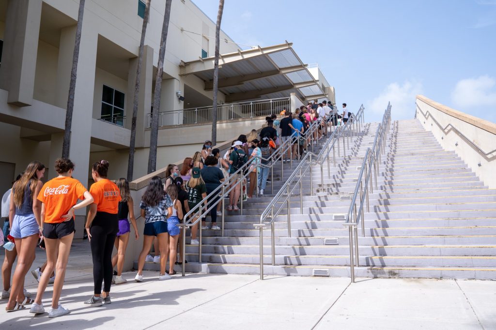 Students line up outside of the Watsco Center on their way to Canefest 2021 on Aug. 22, 2021.