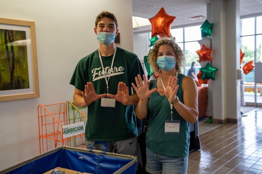 Michael and Melissa Cassidy throw up the U while moving into Stanford Residential College on Aug. 17, 2021.