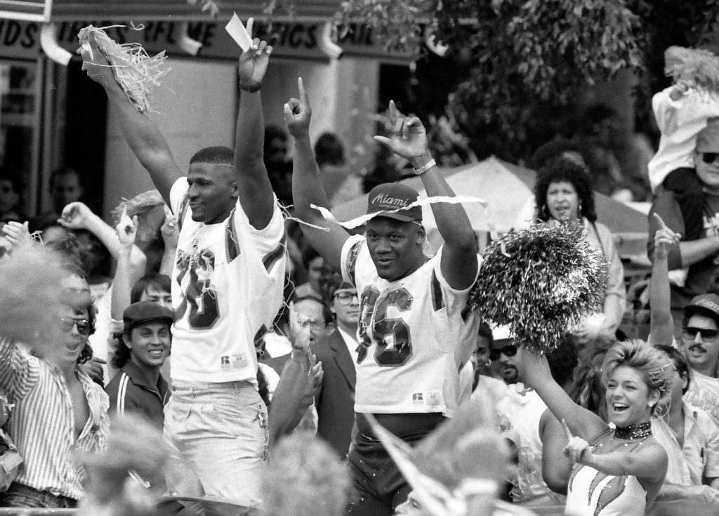 University of Miami defensive back Bennie Blades and defensive end Daniel Stubbs celebrate the National Championship during a ticker tape parade in downtown Miami January 1988. The Hurricanes defeated the Oklahoma Sooners 20-14 for the national title.
