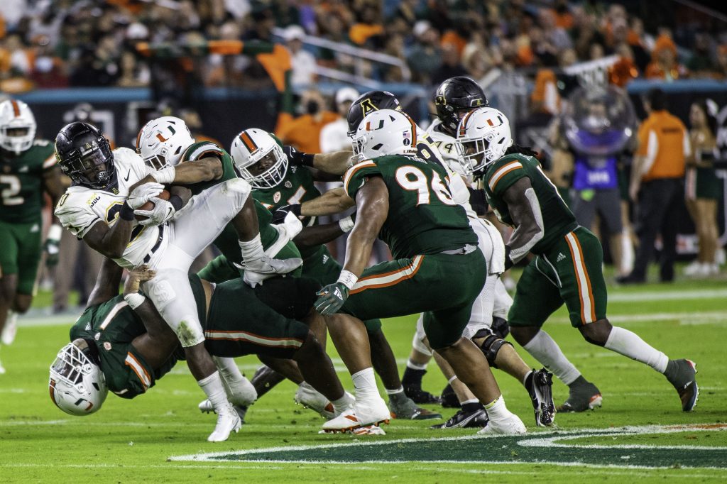 Junior Nesta Silvera tackles Appalachan State’s running back, sophomore Nate Noel, at Hard Rock Stadium during the first half at Hard Rock Stadium on Saturday Sept. 11. Silvera had four total tackles on the night in Miami’s 25-23 win.