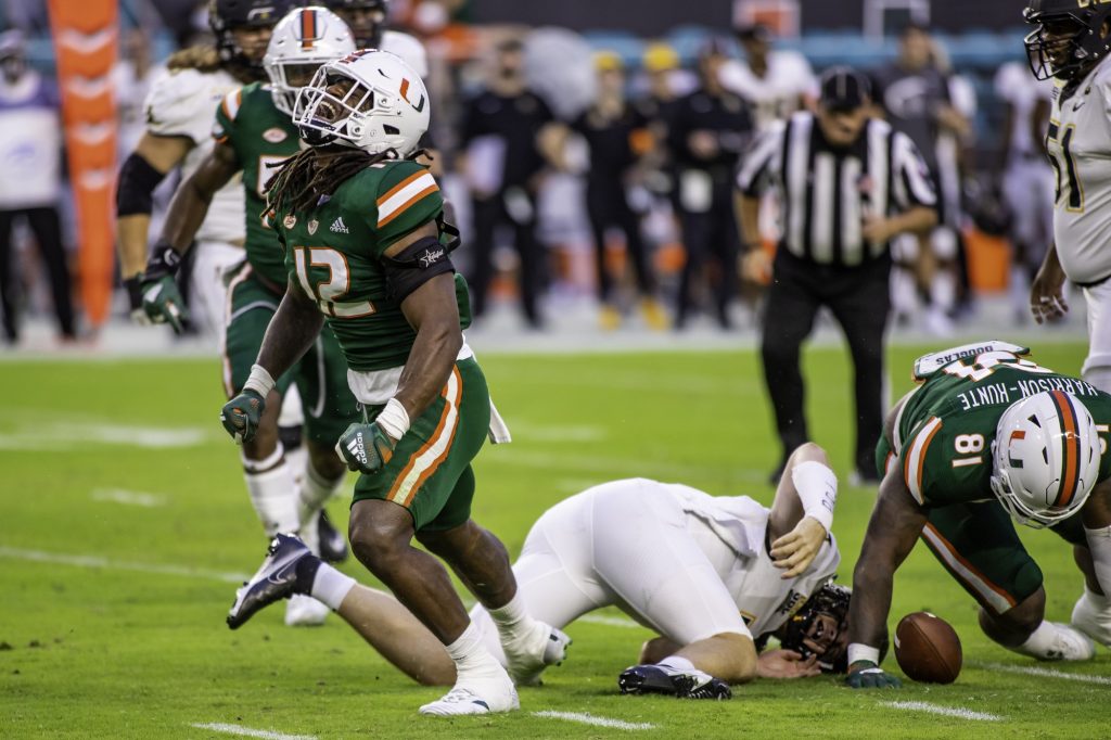 Redshirt freshman Jafari Harvey celebrates after recording Miami’s only sack of the game early in the first quarter at Hard Rock Stadium on Saturday Sept. 11. Harvey finished the game with two solo tackles and four total tackles.