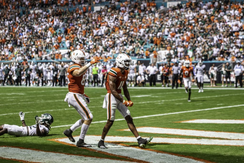 Charleston Rambo (11) celebrates after scoring a touchdown in the second half of Miami's game against Michigan State on Sept. 18 at Hard Rock Stadium.