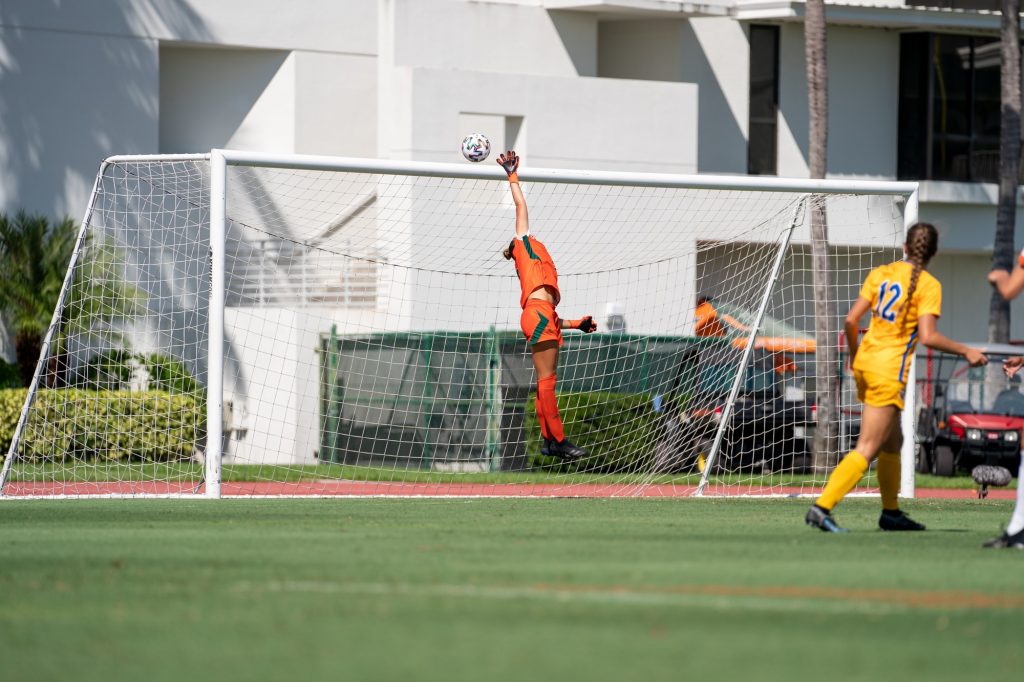 Junior goalkeeper Melissa Dagenais leaps in an attempt to block a shot on goal during the first half of Miami’s match versus Pittsburgh at Cobb Stadium on Sept. 26, 2021.