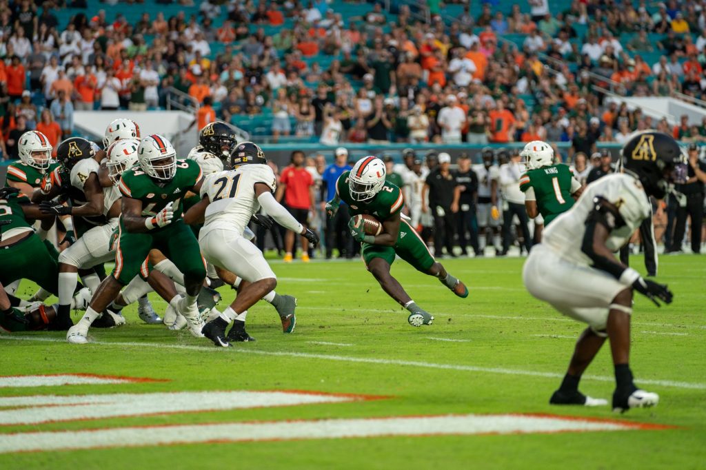 Freshman running back Don Chaney, Jr. finds a gap between defenders and runs into the end zone during Miami's game versus Appalachian State at Hard Rock Stadium on Sept. 11, 2021.