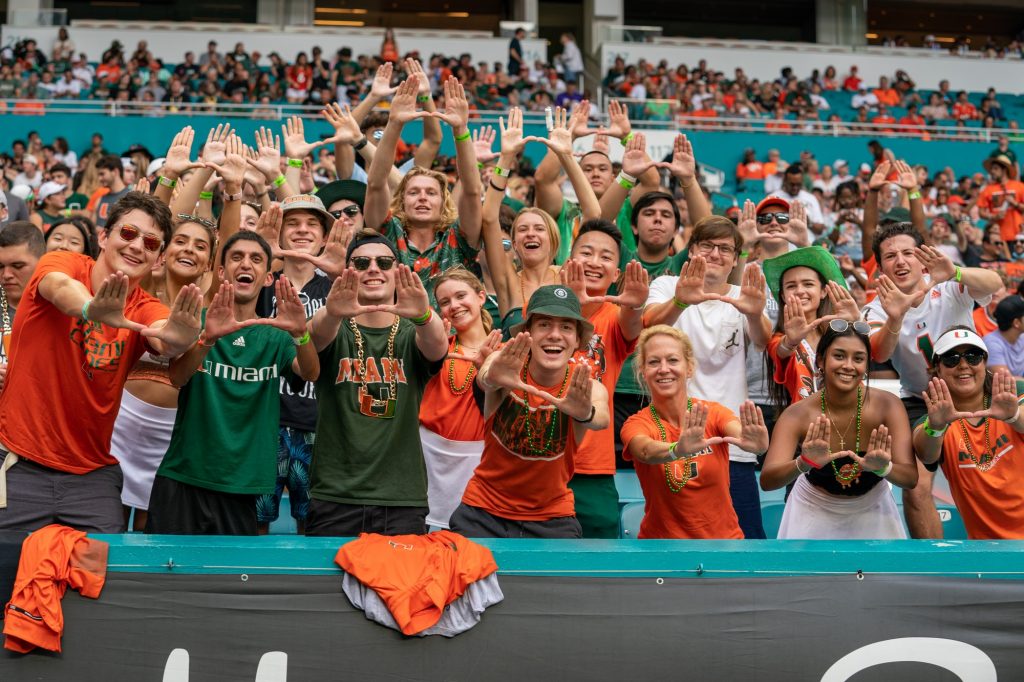 Canes fans and family members throw up the U in the student section during Miami’s game versus Central Connecticut State University at Hard Rock Stadium on Sept. 25, 2021.