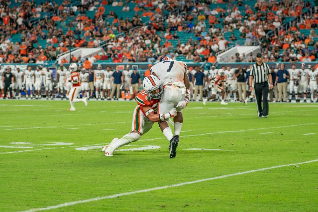 Redshirt junior safety Bubba Bolden tackles running back Mike Hollins during the second quarter of Miami’s game versus the University of Virginia at Hard Rock Stadium on Sept. 30, 2021. Bolden finished the game with five solo tackles.