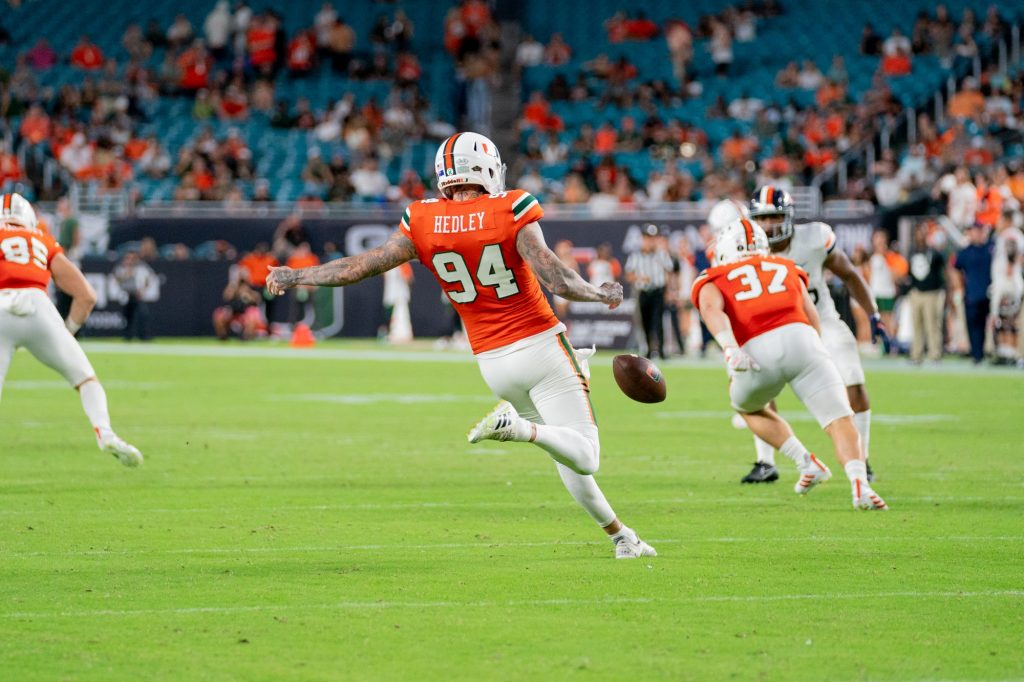 Redshirt junior punter Lou Hedley punts the ball during the third quarter of Miami’s game versus the University of Virginia at Hard Rock Stadium on Sept. 30, 2021. Hedley punted 8 times, with a long of 62 yards.