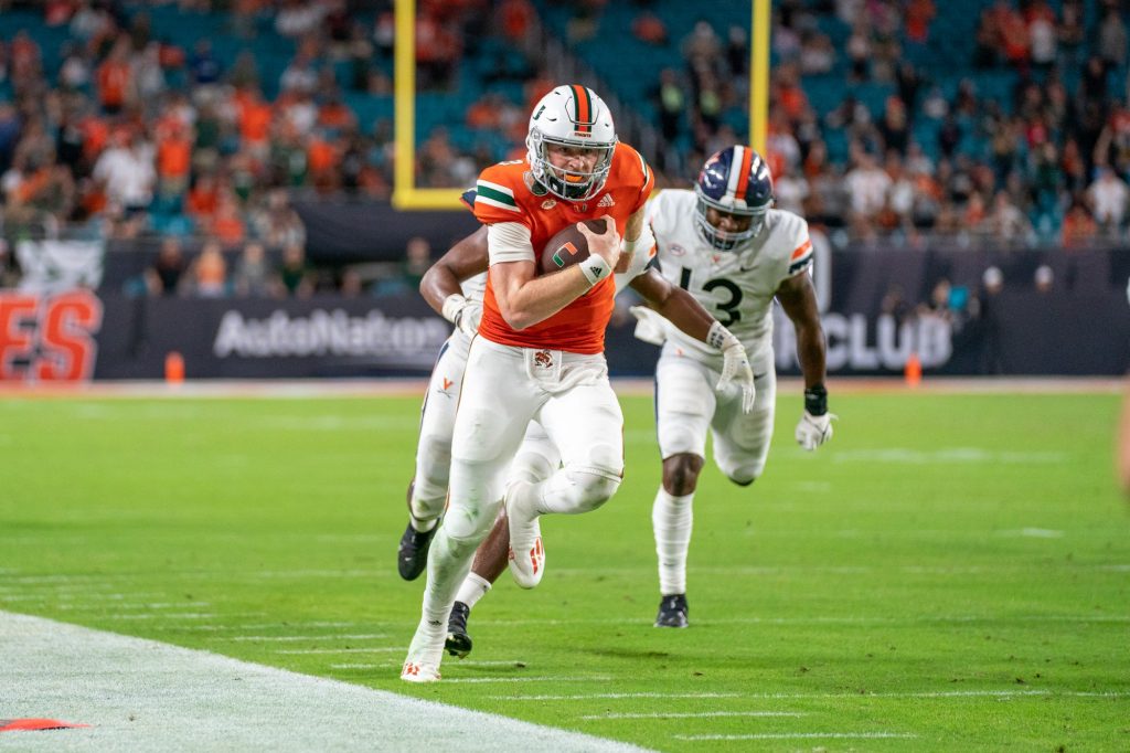 Freshman quarterback Tyler Van Dyke rushes towards the end zone during the third quarter of Miami’s game versus the University of Virginia at Hard Rock Stadium on Sept. 30, 2021. Van Dyke rushed for 24 yards, scoring a touchdown on the play.