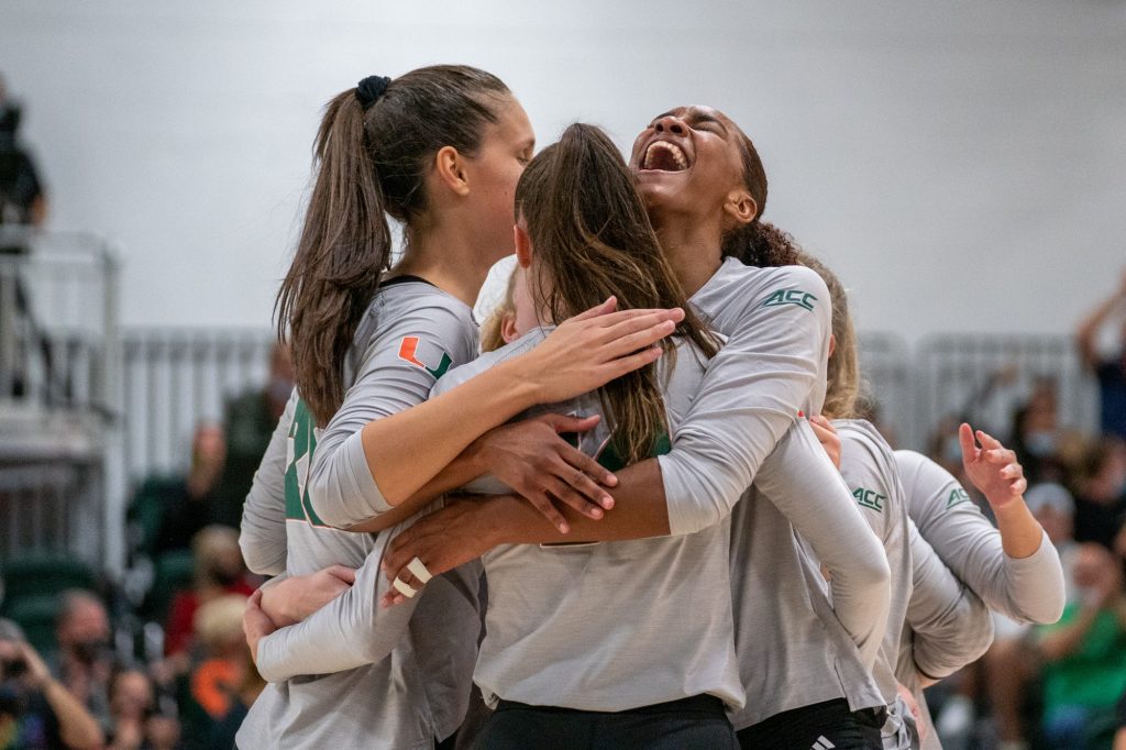 Junior middle blocker Janice Leao celebrates with teammates after Miami won the first set of their match versus the University of North Carolina in the Knight Sports Complex on Oct. 1, 2021.