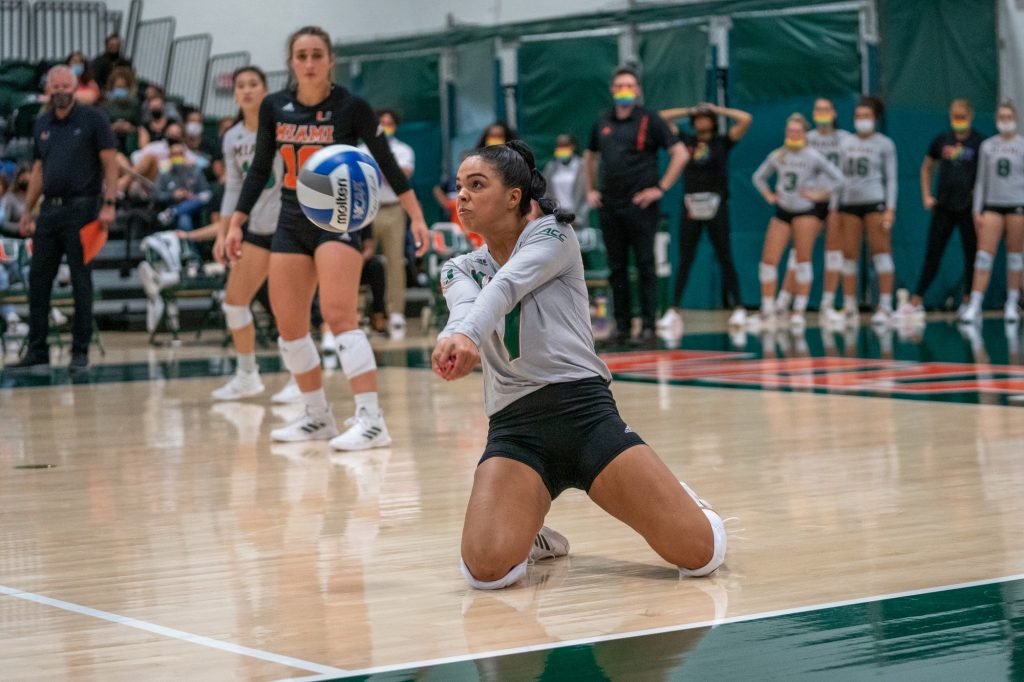 Freshman defensive specialist Yaidaliz Rosado bumps the ball during the fourth set of Miami’s match versus the University of North Carolina in the Knight Sports Complex on Oct. 1, 2021.