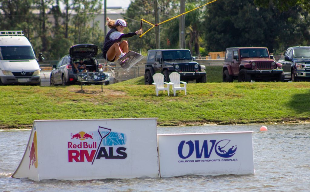 Freshman Daniela Abuchaibe performing a big tail grab at the Redbull Rivals Wakeboarding tournament at Orlando Watersports Complex. Abuchaibe later qualified for the final round of the Big Air Kicker competition.