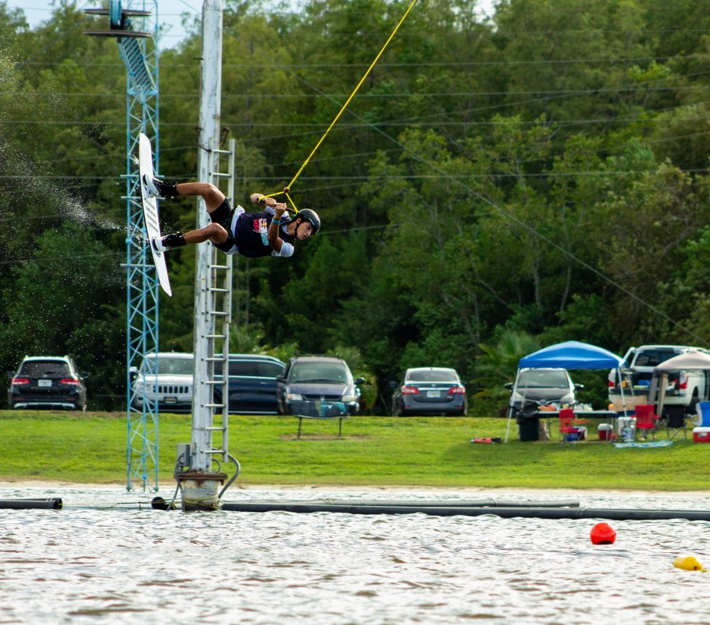 Freshman Diego Paredes mid-air while competing in the Redbull Rivals Wakeboarding competition at Orlando Watersports Complex. Paredes is individually competing in the One Fall Competition.