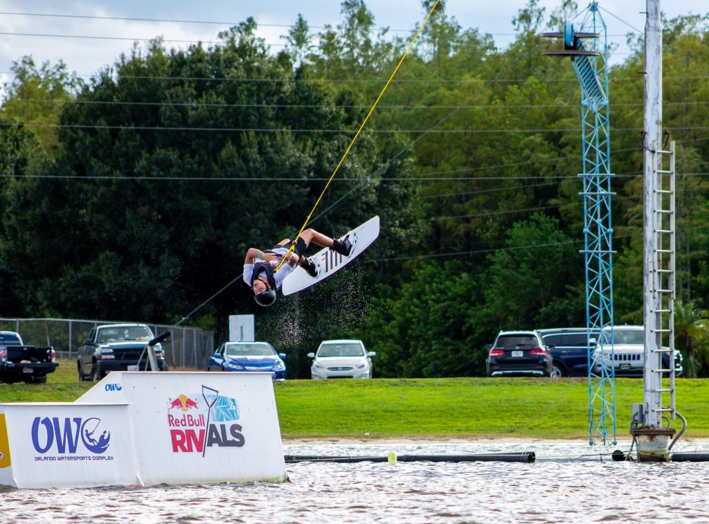 Freshman Diego Paredes performing a toe side roll to revert his body weight in the Big Air Kicker Competition at Orlando Watersports Complex. Paredes competed against four different universities at the RedBull-sponsored competition.