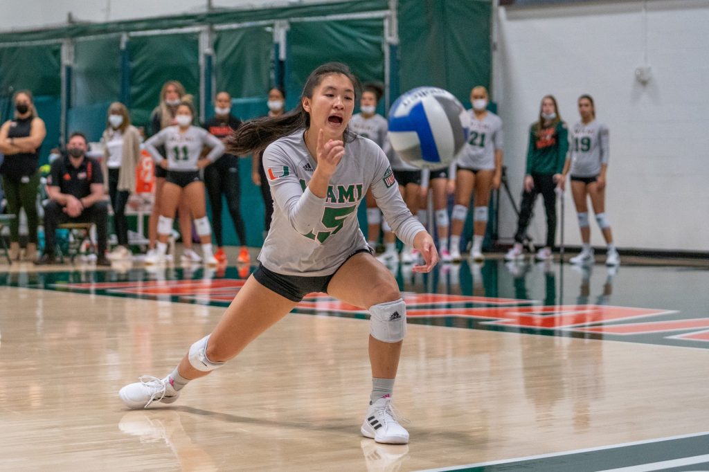 Senior defensive specialist Emily Damon indicates that a ball is heading out of bounds during the first set of Miami’s match versus Syracuse in the Knight Sports Complex on Oct. 29, 2021.