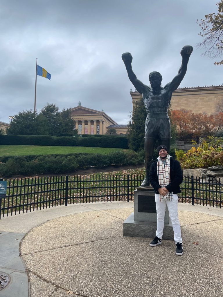 Elfeky poses in front of the famous Rocky statue outside of the Philadelphia Museum of Art as he explores the city during Thanksgiving break.