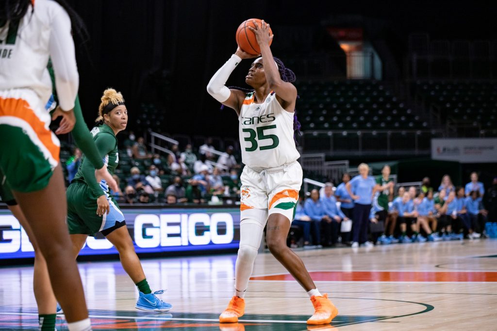 Senior Naomi Mbandu takes a shot from the top of the key during the second half of Miami’s win on Sunday, Dec. 5 at the Watsco Center.