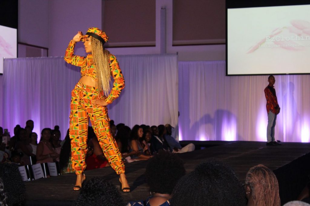 Senior Mirza Tanis walks the runway in a matching three-piece, Ankara outfit in 2019.