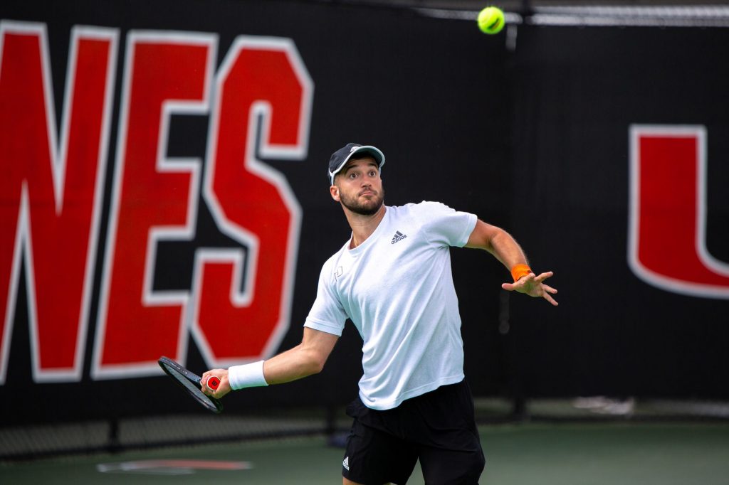 Graduate Student Dan Martin returns the ball during doubles matches against Georgia State on Feb. 18 at the Neil Schiff Tennis Center in Coral Gables.