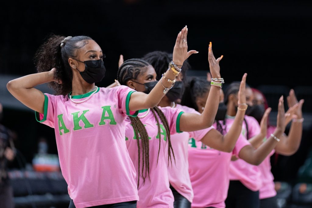 Members of the Alpha Kappa Alpha Sorority perform at halftime of Miami’s game versus Pittsburgh in The Watsco Center on Feb. 17, 2022.
