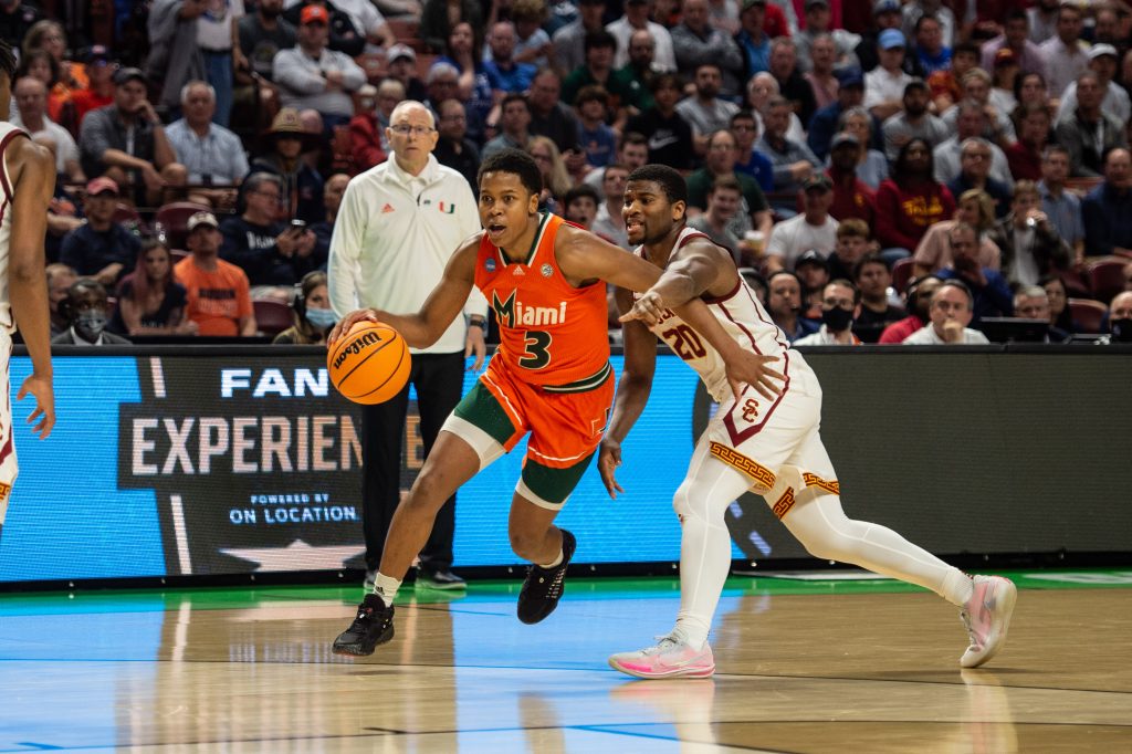 Sixth-year redshirt senior guard Charlie Moore dribbles past a defender in 10th-seeded Miami's 68-66 upset over seventh-seeded Southern California on Friday, March 18, 2022 at Bon Secours Wellness Arena in Greenville, South Carolina.