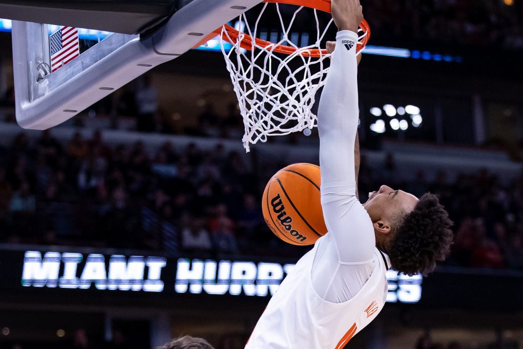 Fourth-year junior Jordan Miller yells as he throws down a put-back dunk in Miami's win over Iowa State at the Sweet 16 at the United Center in Chicago on Friday, March 25, 2022.