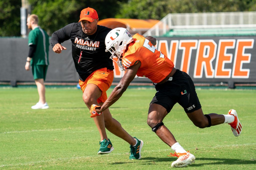Offensive Coordinator Josh Gattis defends third-year sophomore wide receiver Key’Shawn Smith during drills at the Greentree Practice Fields on March 11, 2022.