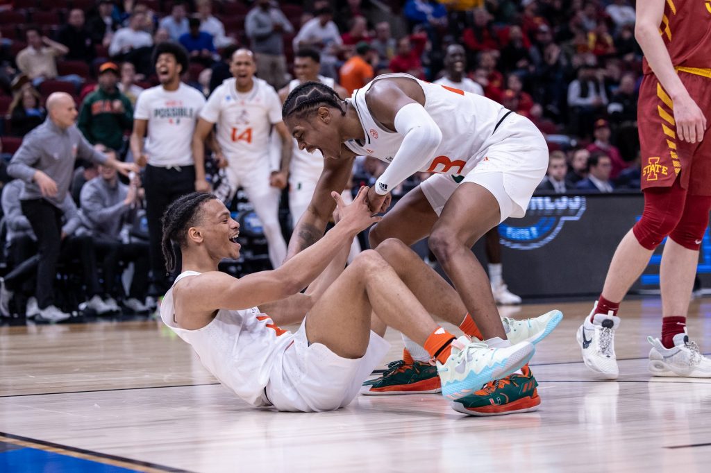 Sixth-year redshirt senior Kameron McGusty celebrates with third-year sophomore Isaiah Wong after Wong hits a shot while getting fouled at the United Center in Chicago on Friday, March 25, 2022.