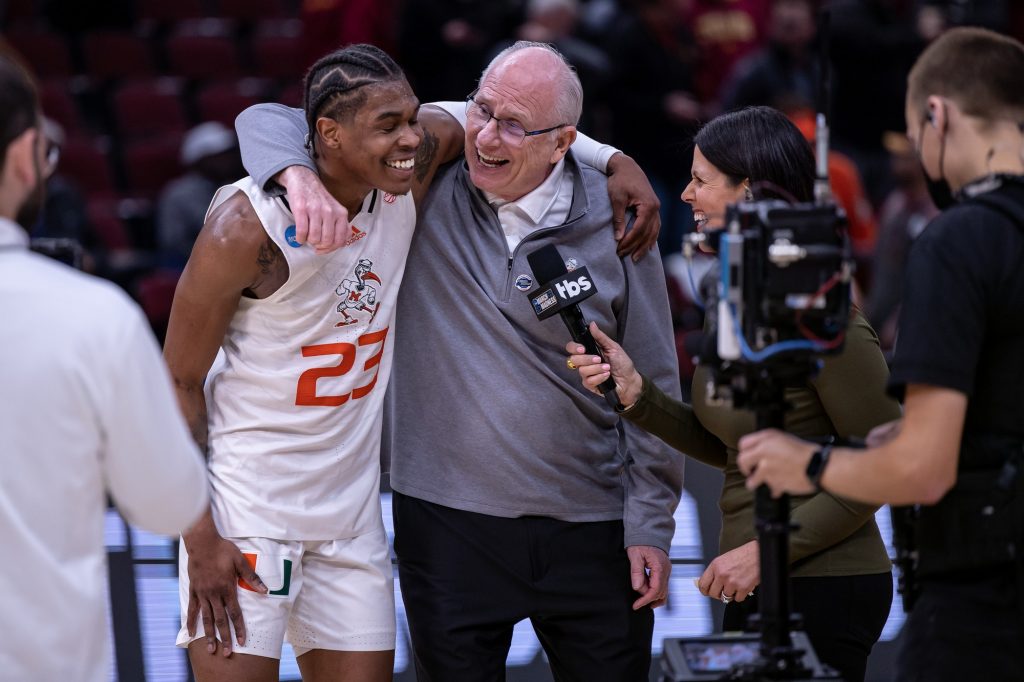 Head coach Jim Larrañaga and sixth-year redshirt senior Kameron McGusty share a moment after Miami's Sweet 16 victory over Iowa State at the United Center in Chicago on Friday, March 25, 2022.