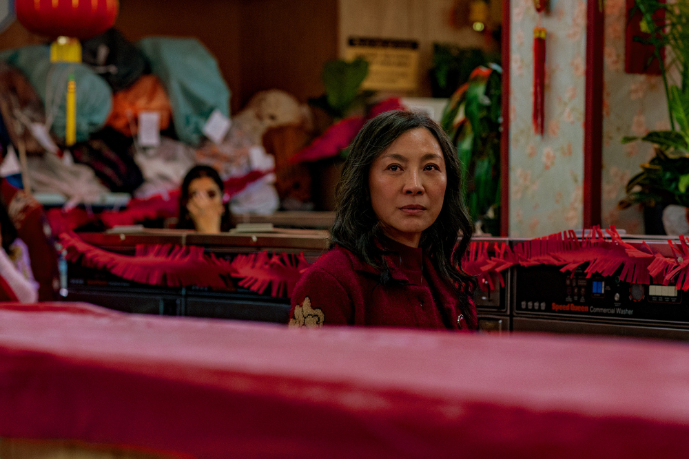 Michelle Yeoh plays a Chinese immigrant who owns a laundromat in Everything Everywhere All at Once. A24.