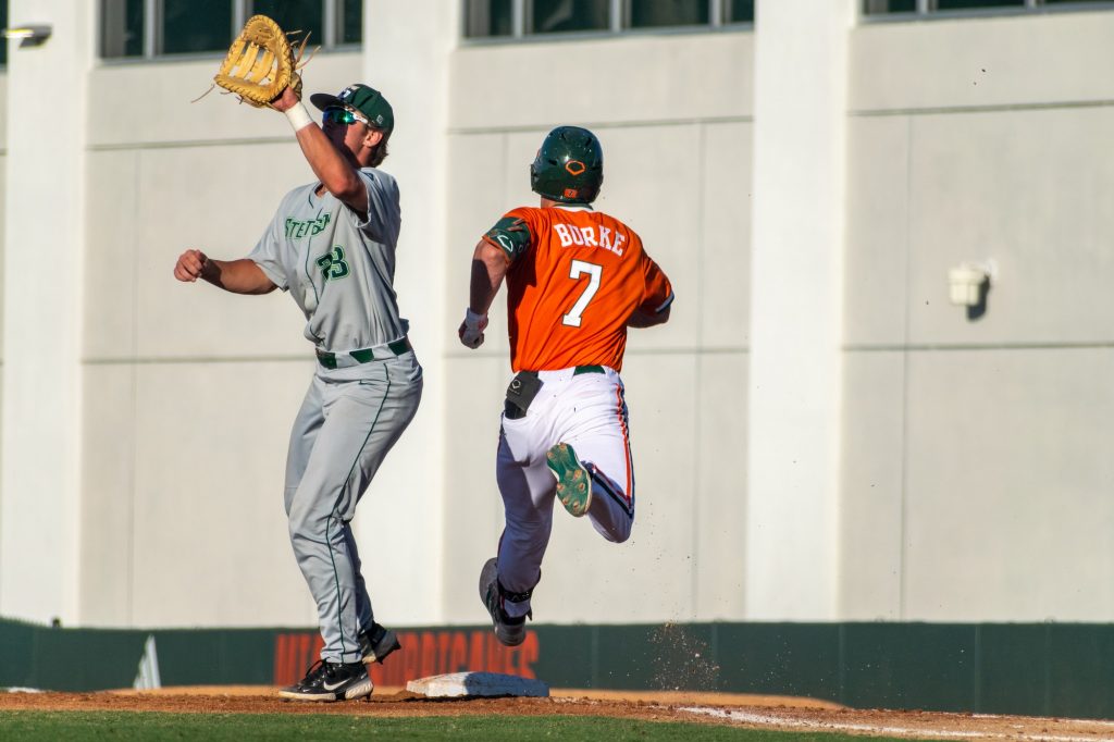 Sophomore outfielder Jacob Burke runs to first base in the bottom of the second inning of Miami's game against Stetson at Mark Light Field on April 26, 2022.