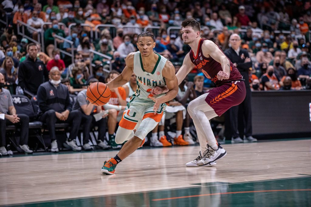 Sophomore Isaiah Wong drives past a Virginia Tech defender along the baseline in Miami's 71-70 loss to Virginia Tech on Saturday, Feb. 26, 2022 at the Watsco Center.