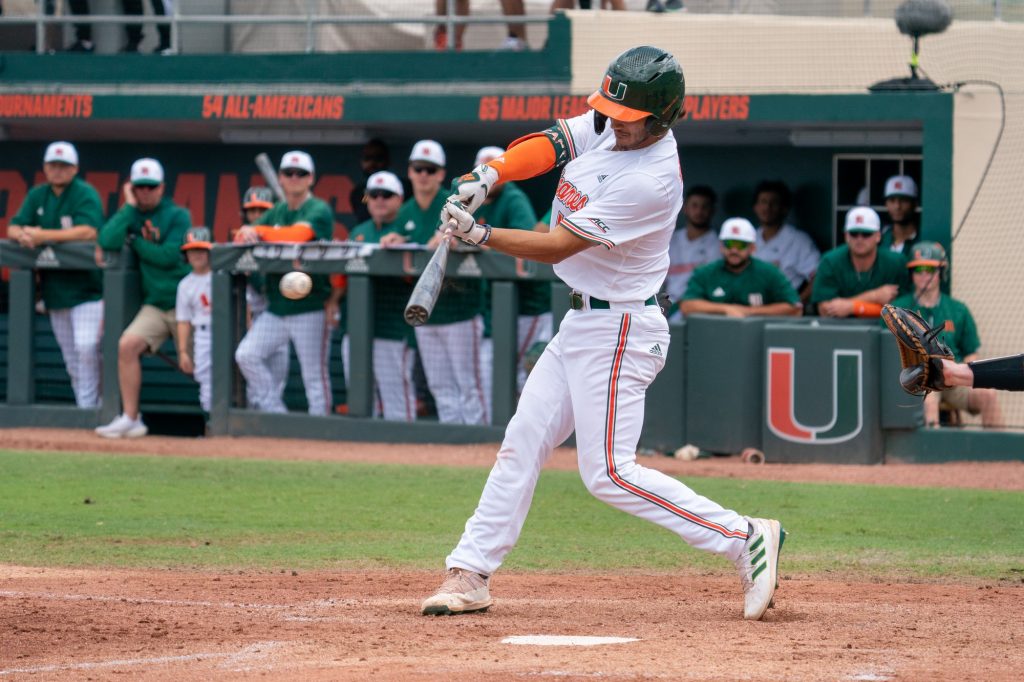 Sophomore infielder Dominic Pitelli hits a double up the middle for two RBI’s in the bottom of the fourth inning of Miami’s game versus Boston College at Mark Light Field on March 13, 2022.