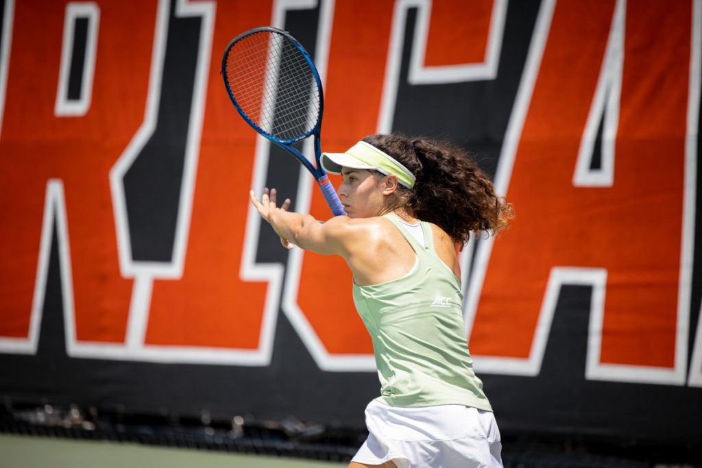 Third-year sophomore Maya Tahan attempts a forehand against Central Florida on May 7. at the Neil Schiff Tennis Center in Coral Gables.