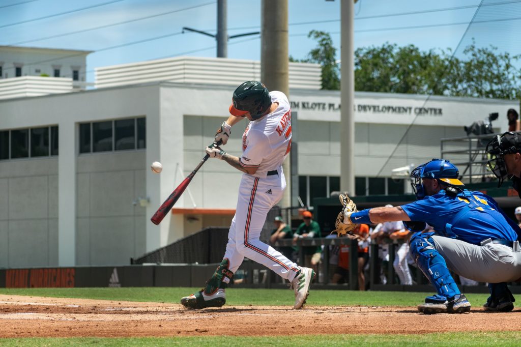 Sophomore infielder CJ Kayfus hits the ball during Miami's game against Pitt on Sunday, April 24, 2022.