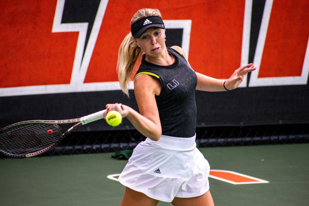 Fifth-year senior Eden Richardson rallies a ball during her doubles matchup against Syracuse on Friday April 15, 2022 at the Neil Schiff Tennis Center.