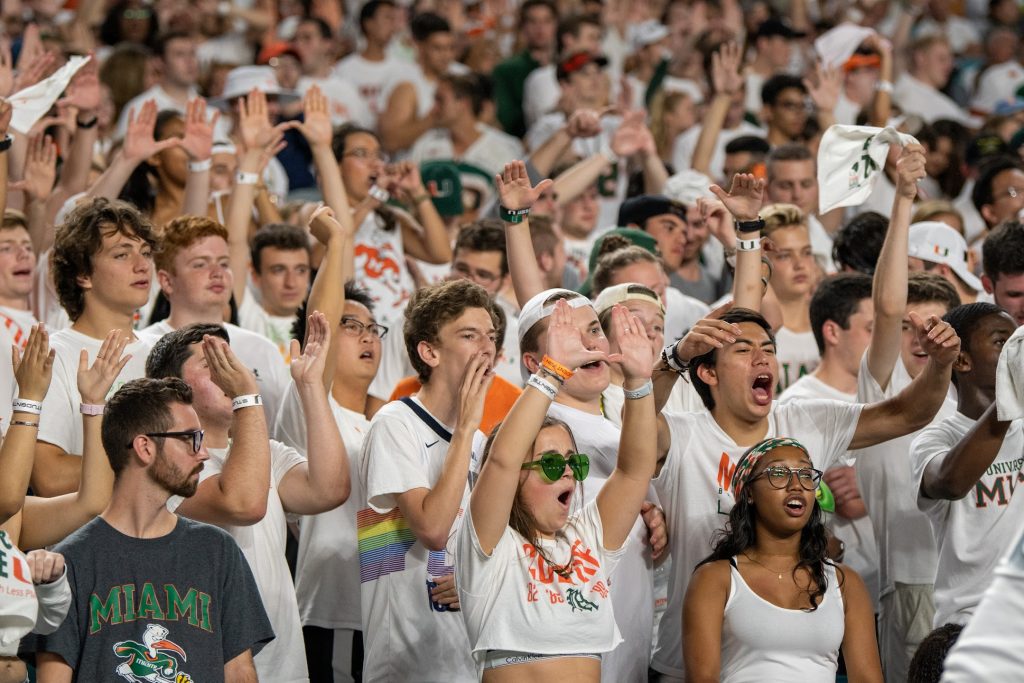 Canes fans celebrate during the Canes game versus the University of Virginia at Hard Rock Stadium on Oct. 11, 2019.