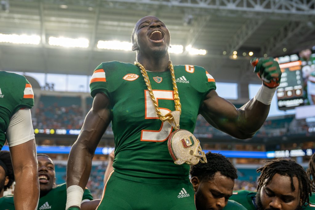 Senior safety Amari Carter celebrates with the Turnover Chain 4.0 after intercepting a pass during the first quarter of Miami’s game versus Appalachian State at Hard Rock Stadium on Sept. 11, 2021.