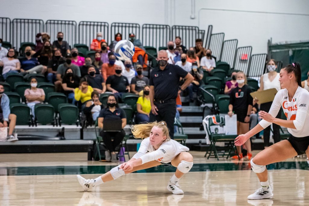 Junior setter Savannah Vach dives to save a point during Miami’s win over FSU on Wednesday Oct. 6 at the Knight Complex in Coral Gables.
