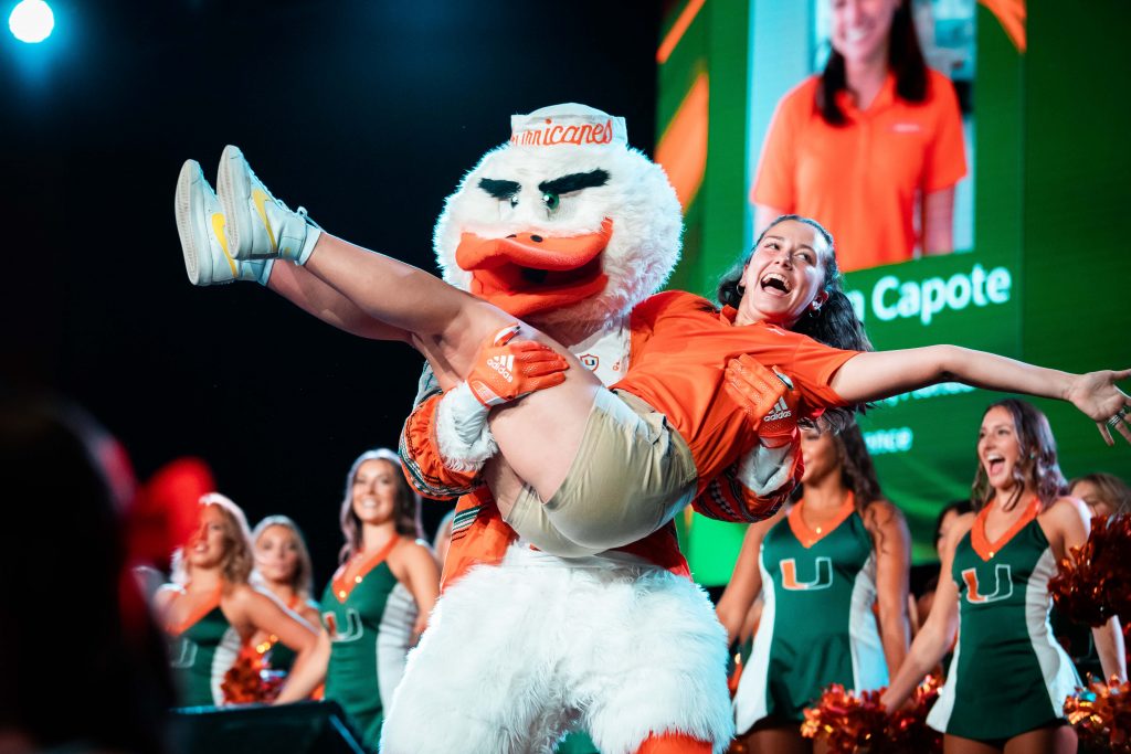 Senior Madison Capote dances with Sebastian at Canes Take Flight on August 17, 2022 at the Watsco Center.