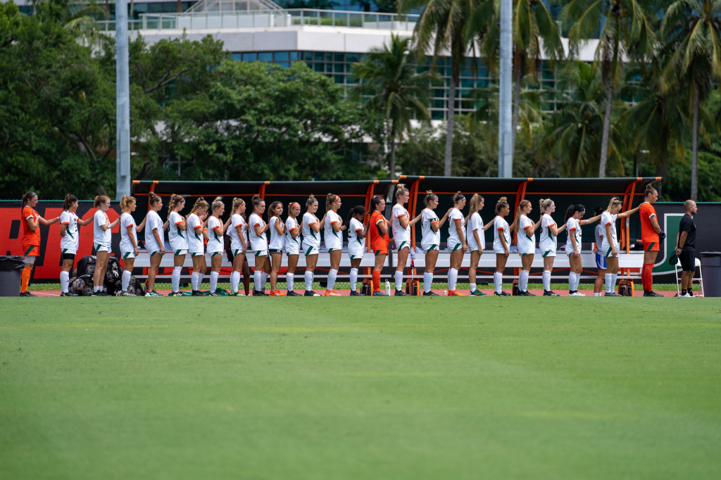 Canes soccer players stand for the national anthem before the start of their match versus USF at Cobb Stadium on Sept. 12, 2021.