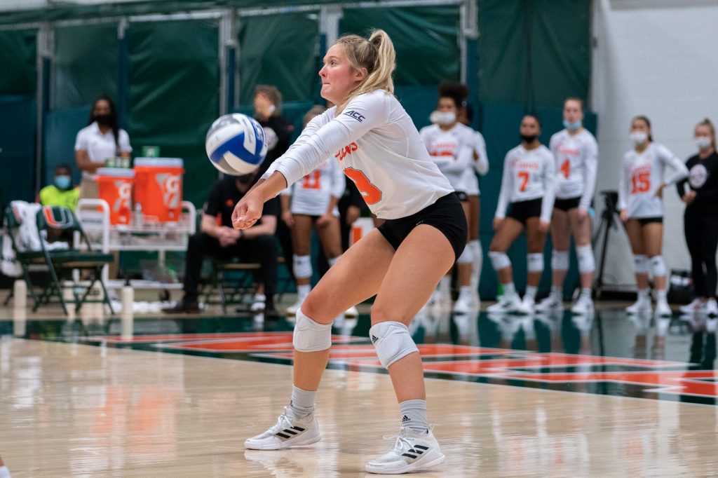 Freshman defensive specialist Hanna Bissler bumps the ball during the Canes’ game versus UMBC in the Knight Sports Complex on Aug. 29, 2021.