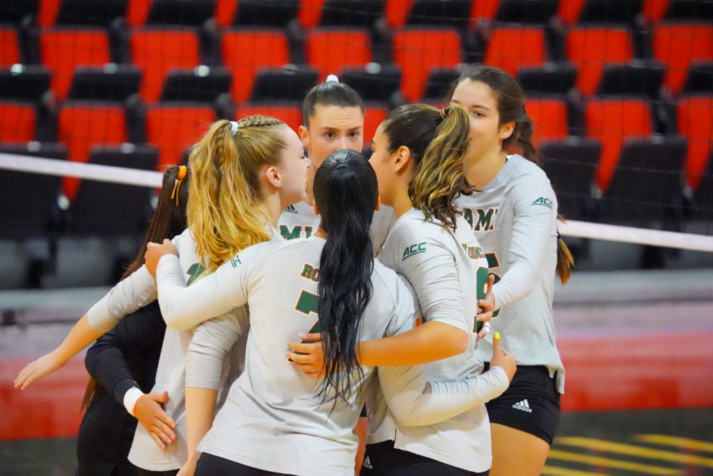 Miami's volleyball team coming together after a point during its game against Weber State on Sept. 3.