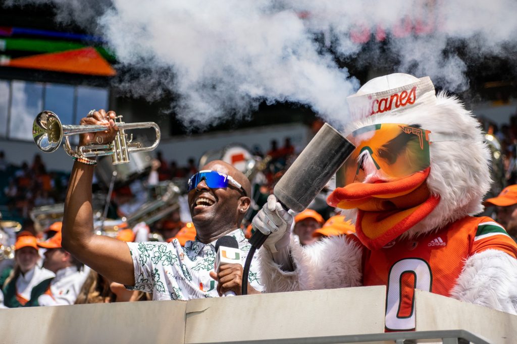 Uptown Dale and Sebastian the Ibis take part in the student section smoke tradition at Miami's game against Southern Miss on Sept. 10 at Hard Rock Stadium.