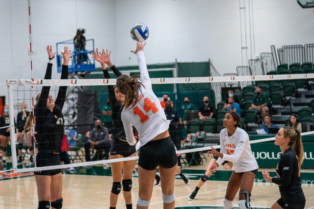 Redshirt sophomore outside hitter Angela Grieve spikes the ball during the Canes’ game versus UMBC in the Knight Sports Complex on Aug. 29, 2021.
